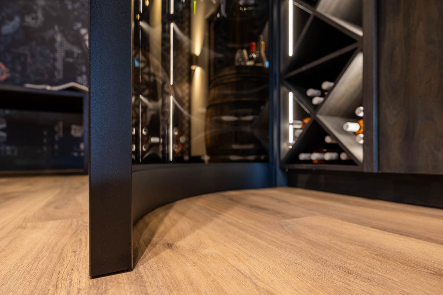 a curved steel screen used in a wine room