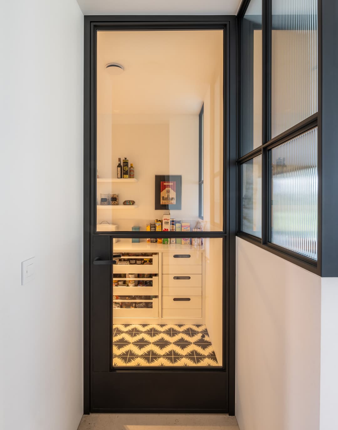 hinged sealed steel glazed internal door leading to a pantry and wine room