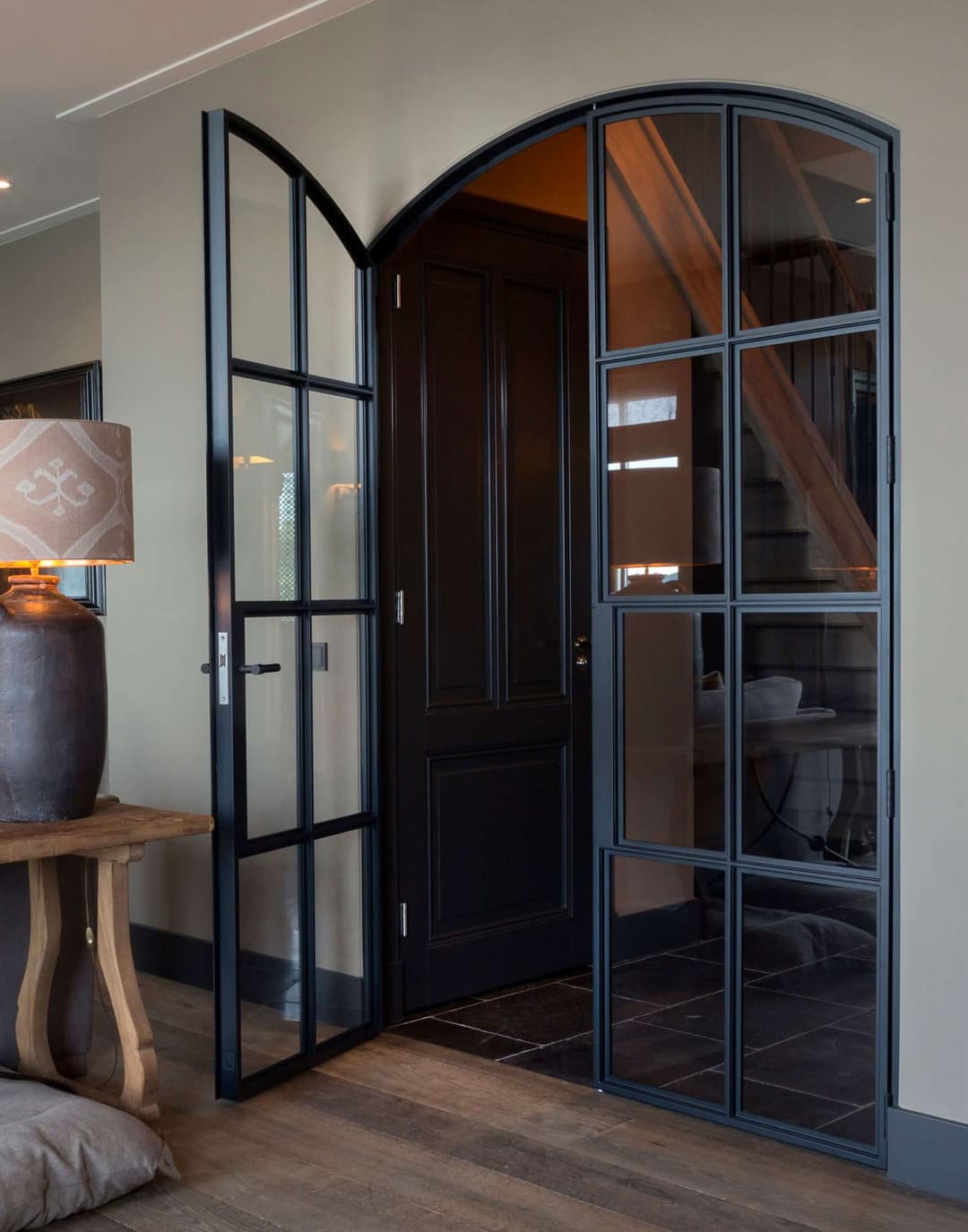 arched steel door in a traditional interior